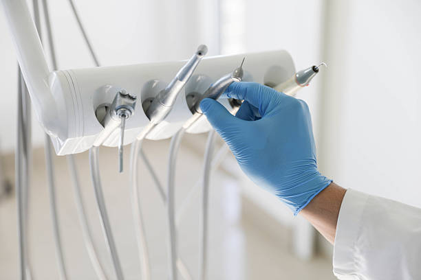 Professional Tooth Extraction technician working in Chevy Chase View, MD